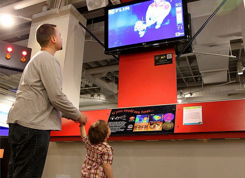 kid and dad looking at ir monitor